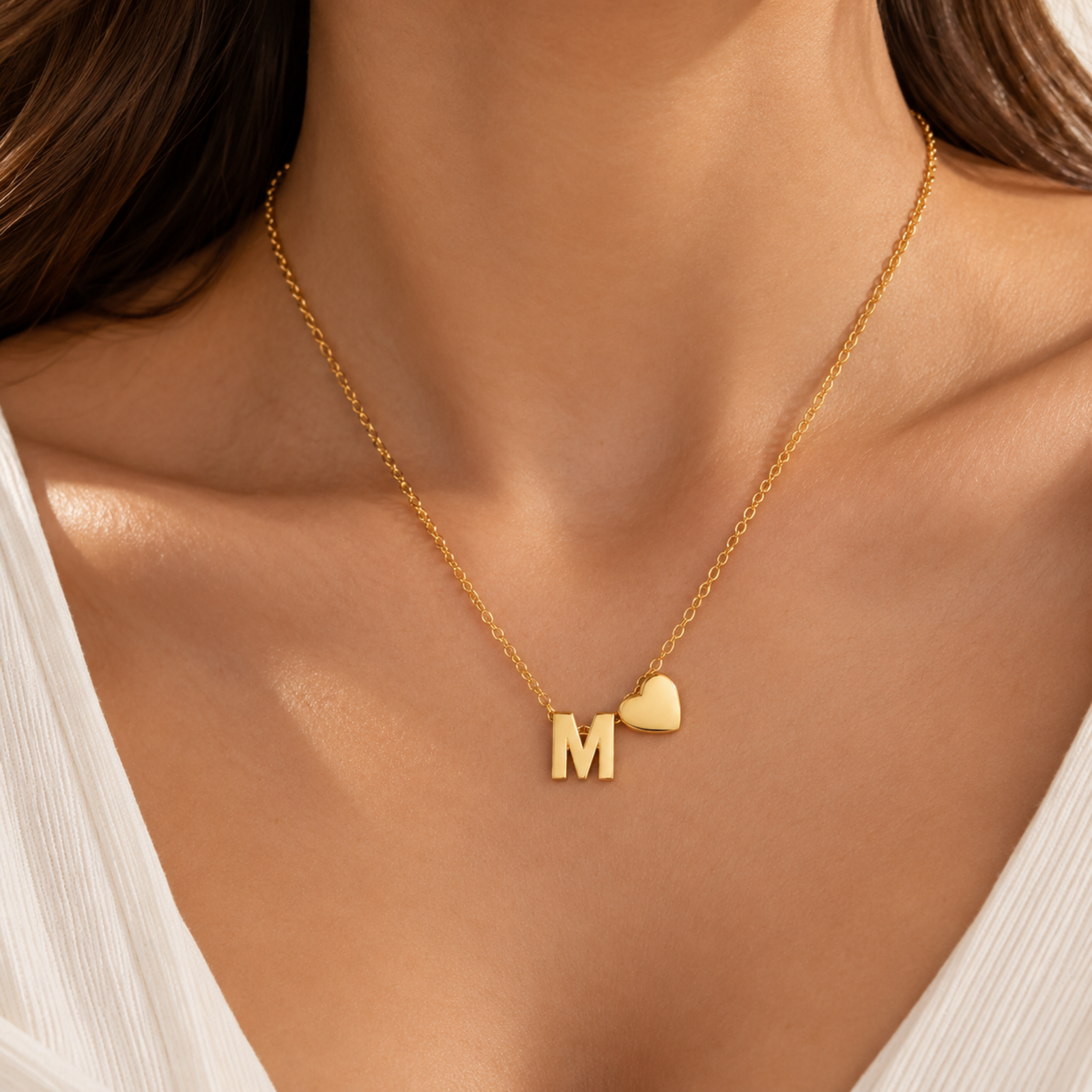anvor-m-initial-necklace-heart-pendant.webp ANVOR M initial necklace with gold-tone letter M and heart pendant