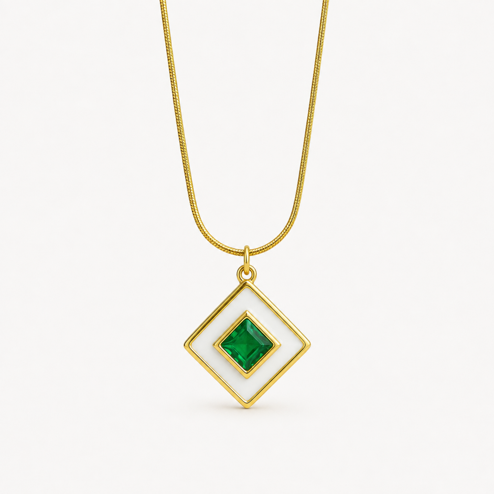 Green Pendant Necklace Design ANVOR green pendant necklace featuring a geometric diamond-shaped pendant with green centre