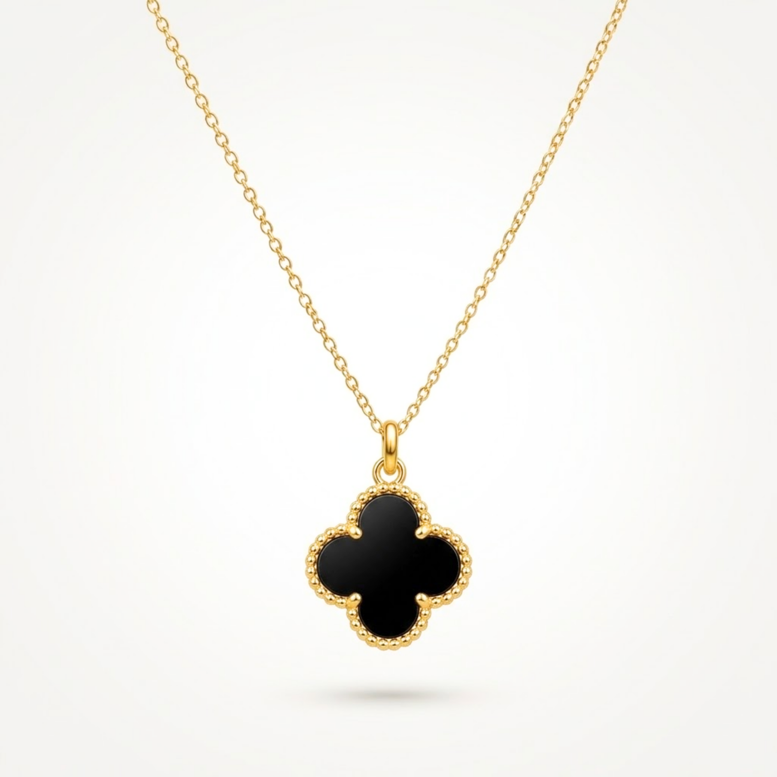 Black Clover Necklace ANVOR black clover necklace with four-lobed pendant and beaded gold-tone frame