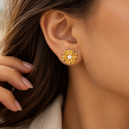 ANVOR pearl stud earrings with sculptural floral design and white pearl-like centre