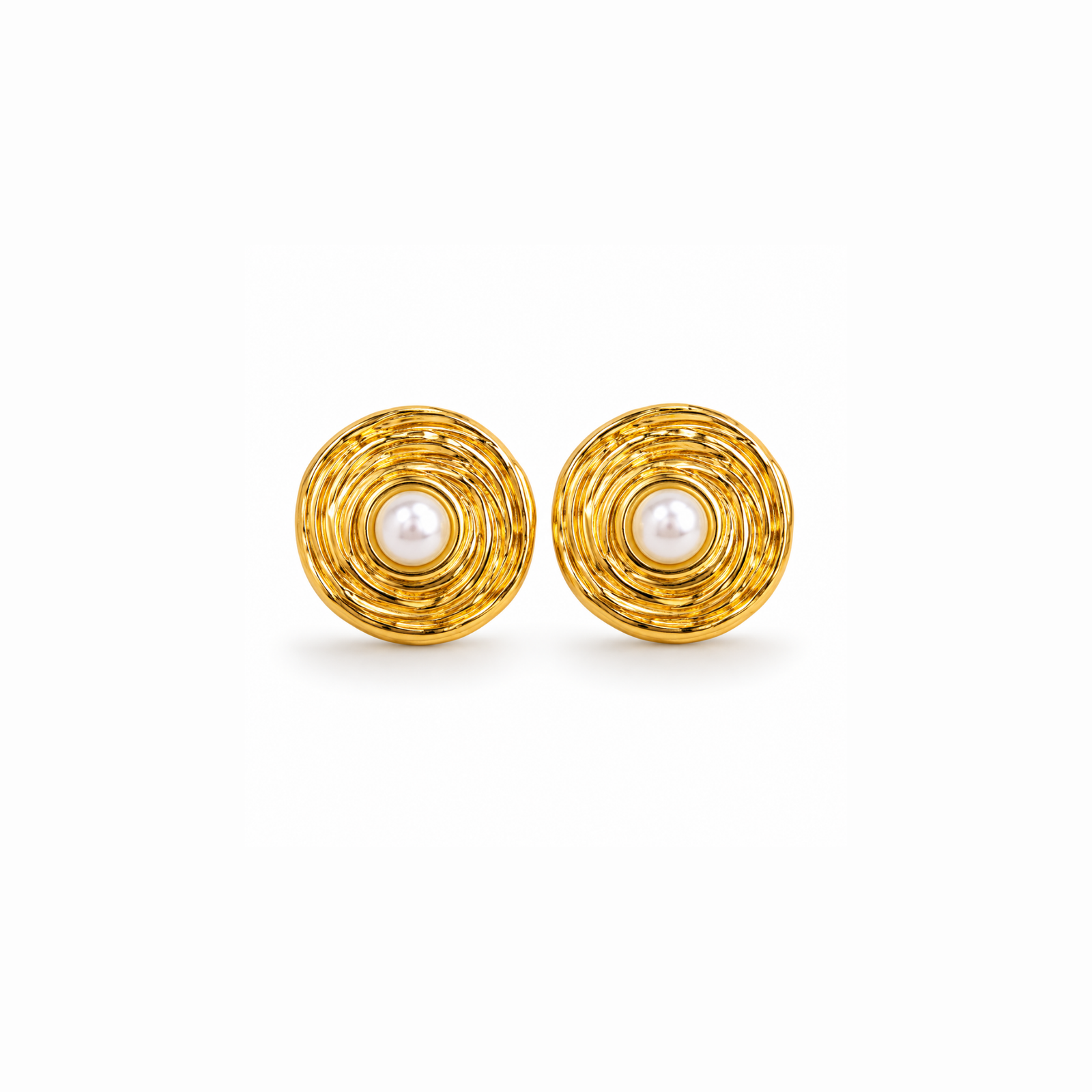 anvor-pearl-stud-earrings.webp ANVOR pearl stud earrings with round pearl-look centres and layered circular detailing