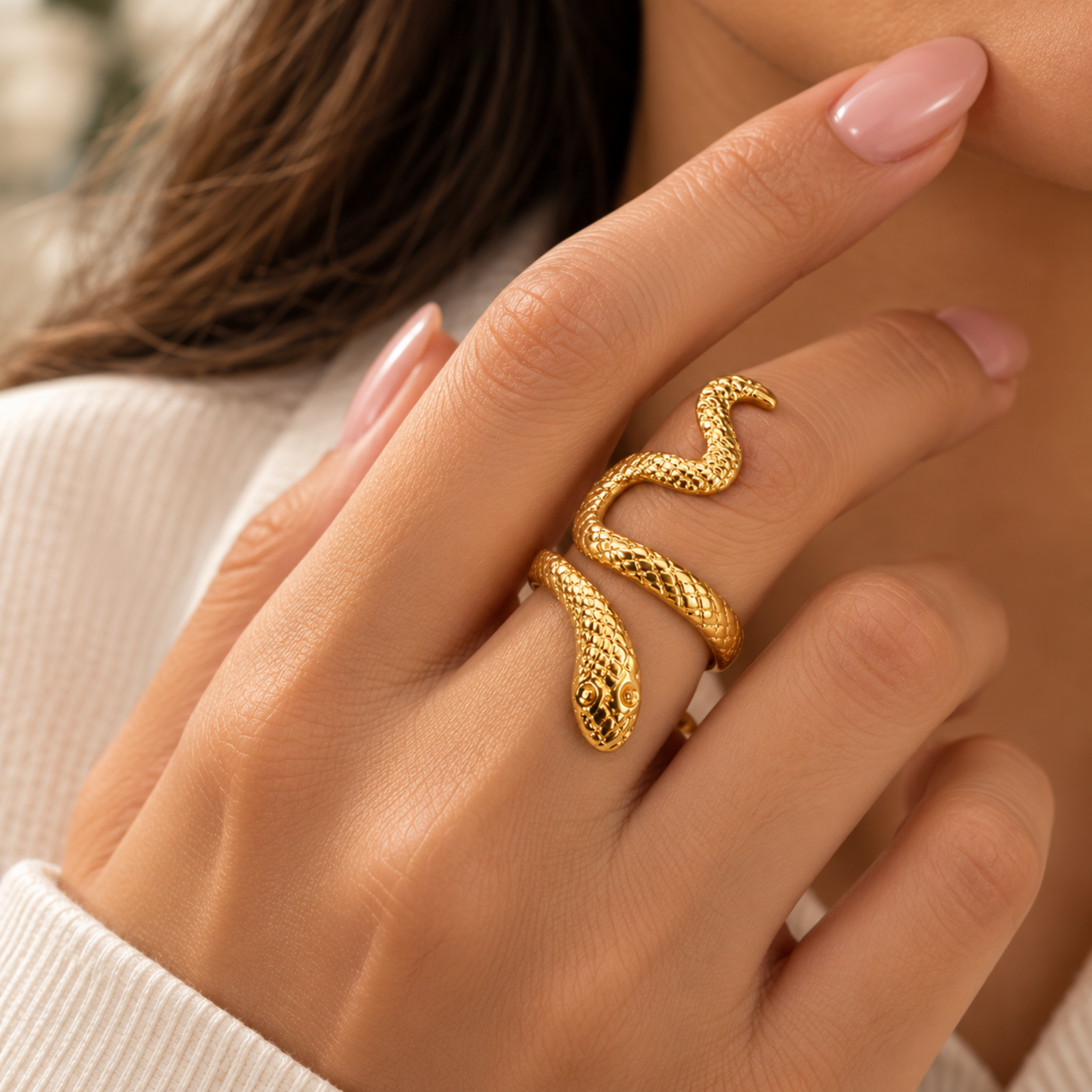 Serpentine Ring Gold-coloured open ring with a flowing serpentine shape and intricate textured detailing on a white background.