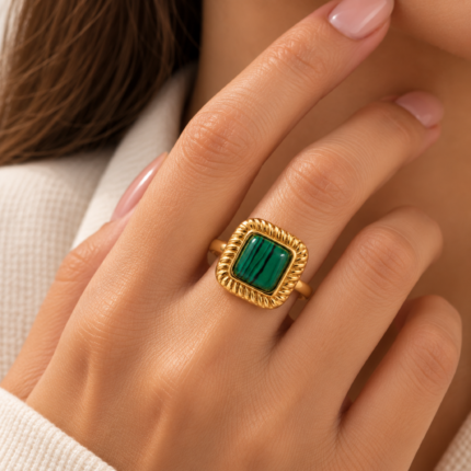ANVOR square statement ring featuring a green centre and detailed textured frame